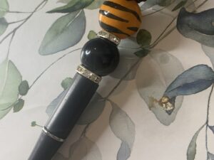 Tiger stripped orange and black pen