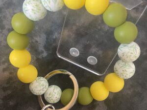 Green leaves and yellow keychain wristlet